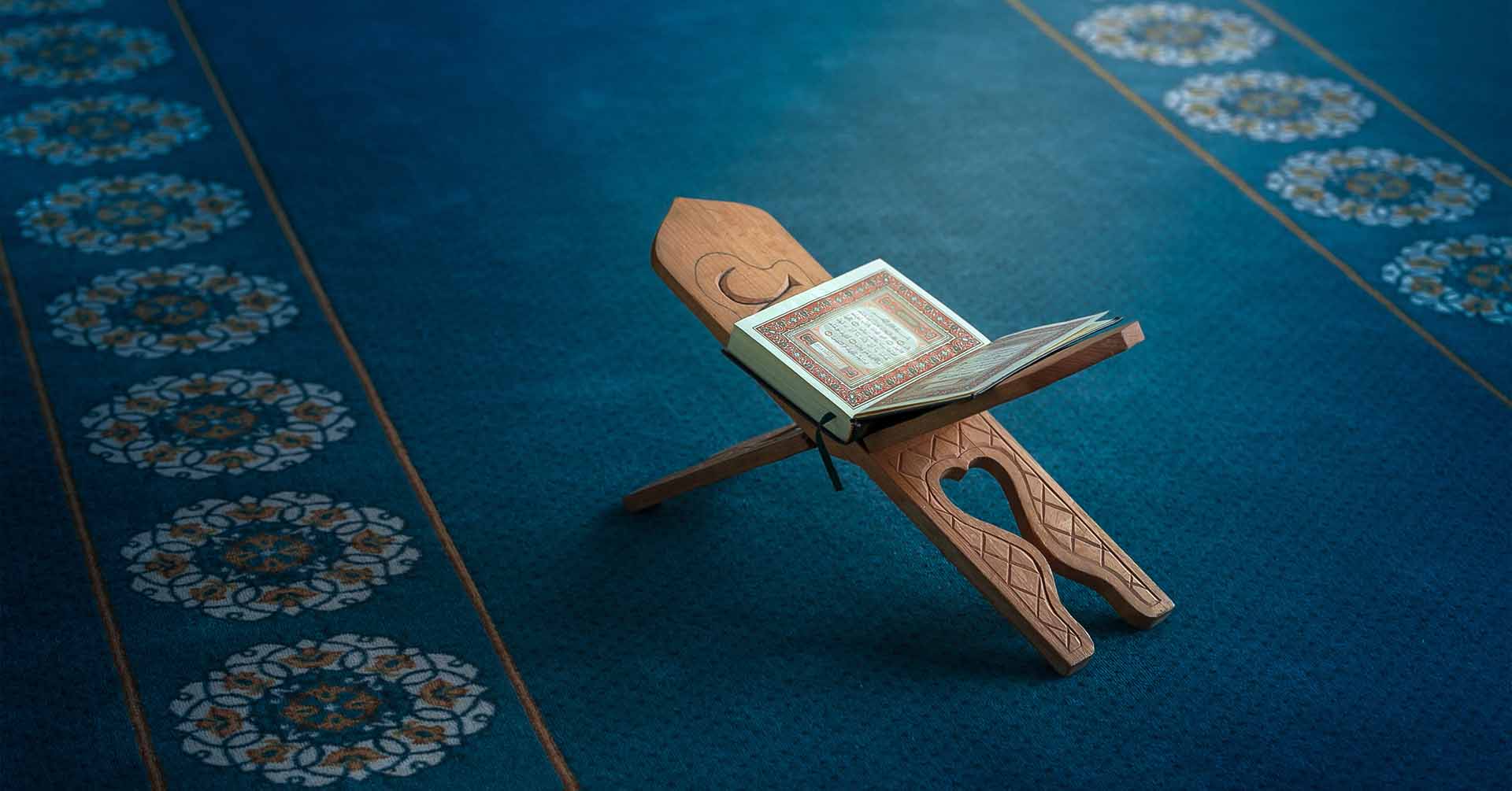 quran on blue prayer carpet 5 pillars of islam