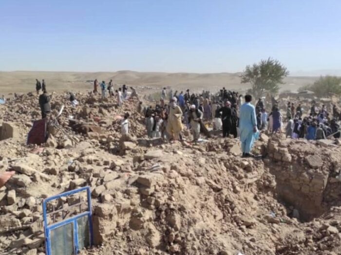 families searching for belongings in afghanistan following earthquake