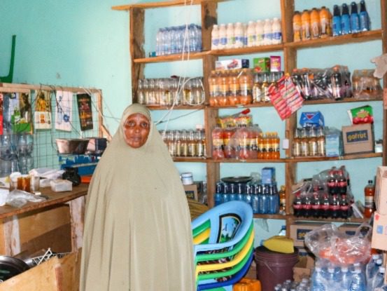 Amina Adow, a mother to 9 children, stood infront of her shop stock