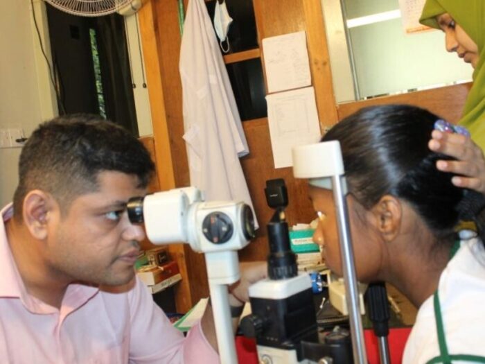 a young female student in bangladesh getting her eyes checked for new glasses, a project funded by islamic relief to support marginalised children