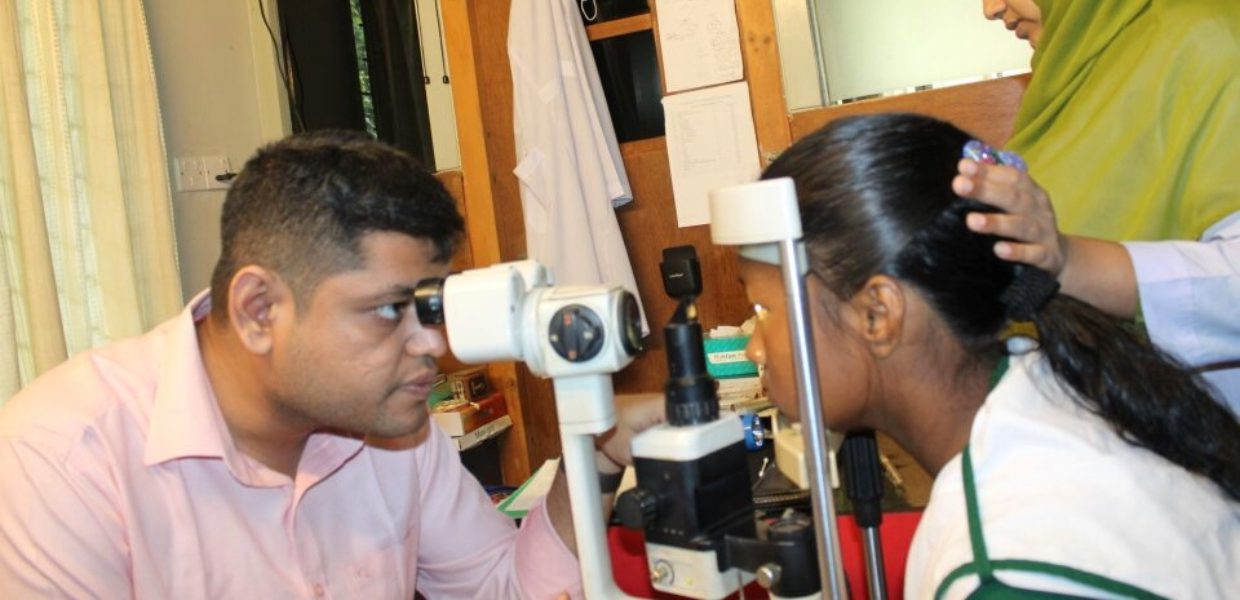 a young female student in bangladesh getting her eyes checked for new glasses, a project funded by islamic relief to support marginalised children