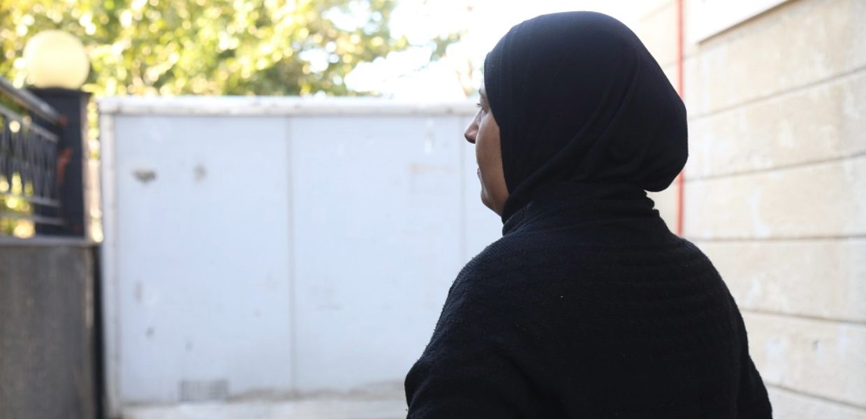 a palestinian woman who is a refugee in Lebanon looking out into the open