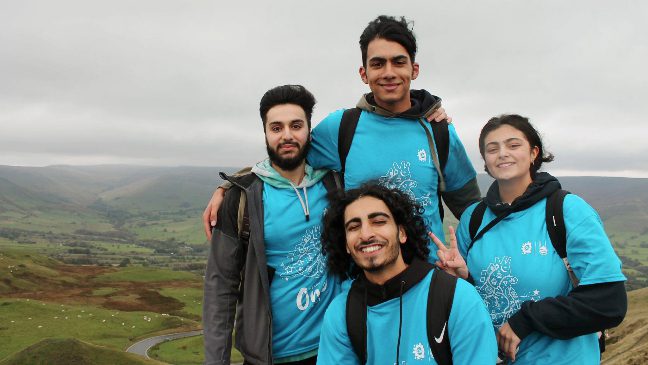 a group of charity week volunteers on a mountain islamic relief