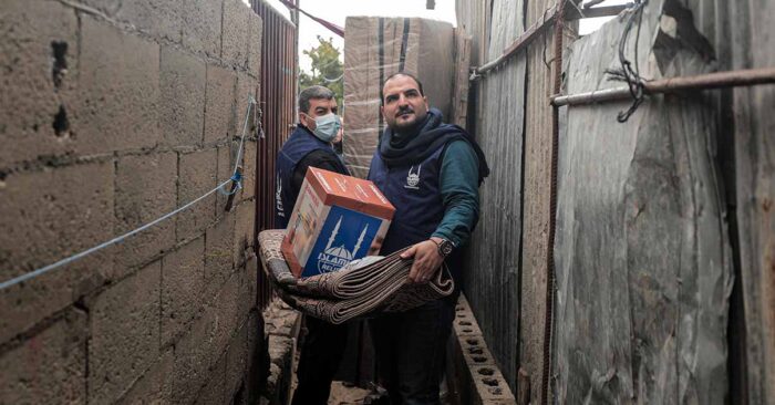 islamic relief representatives distributing winter aid to syrian refugees in camps in lebanon for winter crisis watch