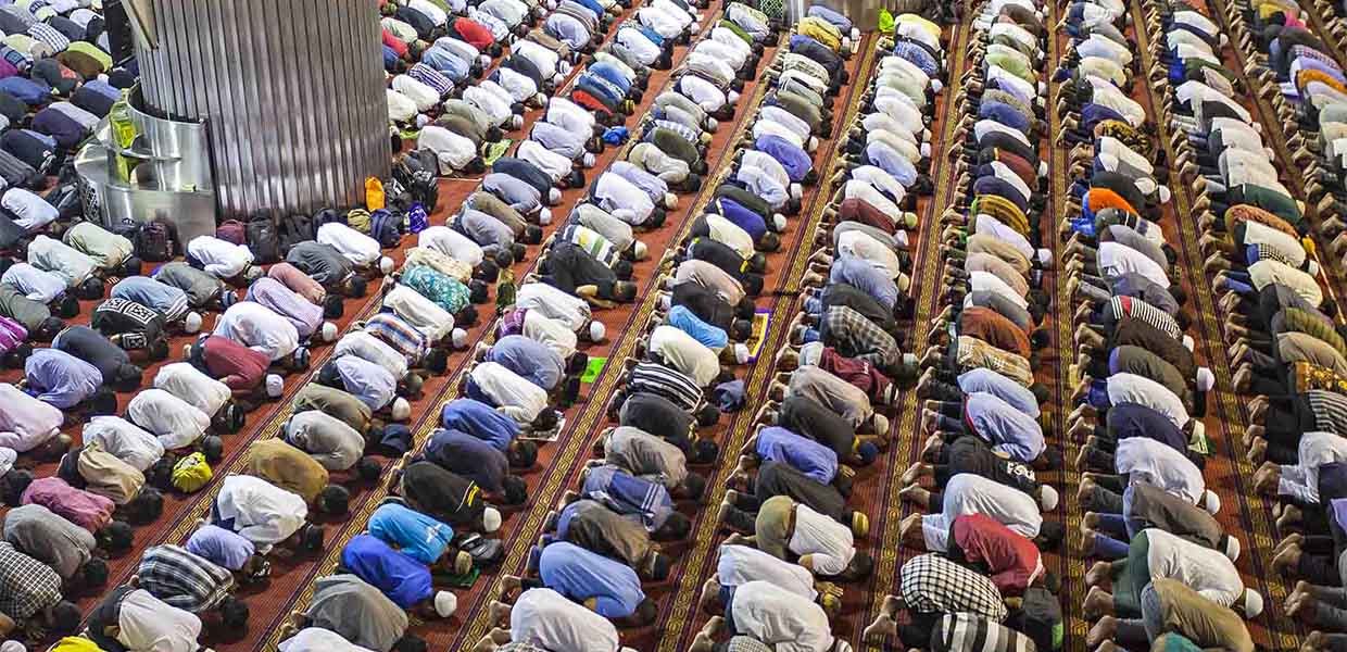 group of men at mosque praying eid salah