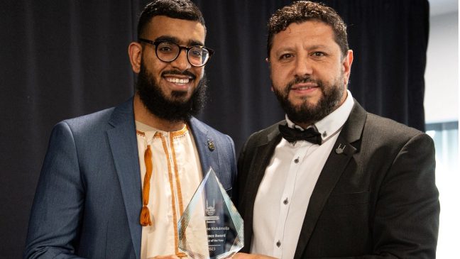 a trophy being handed to one of the winners of islamic relief's lifesavers award