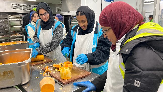 islamic relief staff volunteering at the felix project to help prepare meals for vulnerable families in london