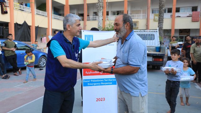 islamic relief staff in gaza providing hot meals to families affected by airstrikes in gaza