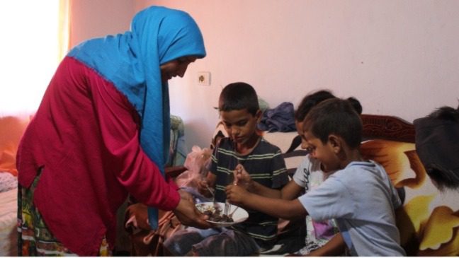 Julian's family enjoying the Qurbani meat