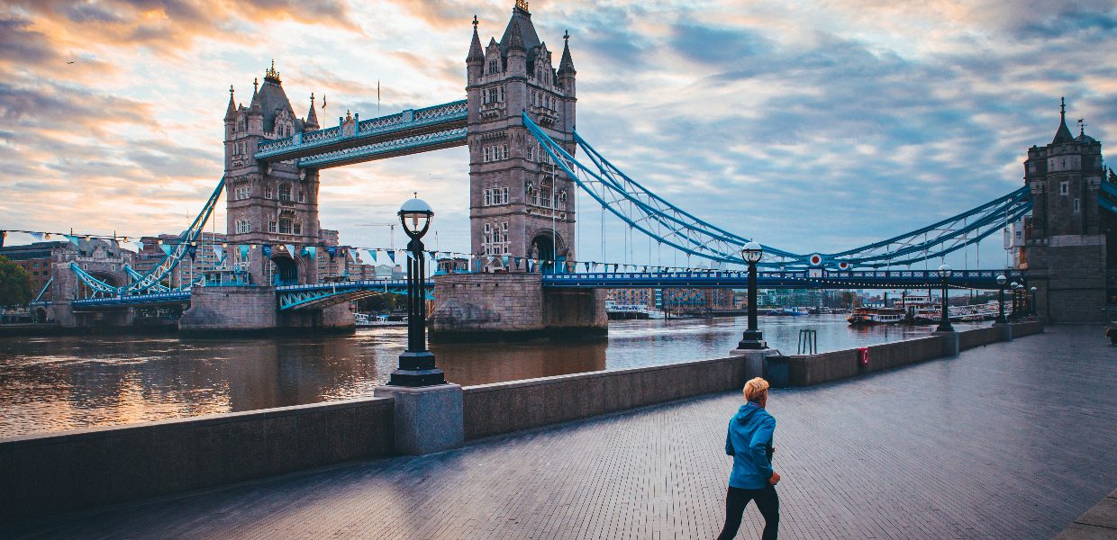 a person running past the tower of london bridge