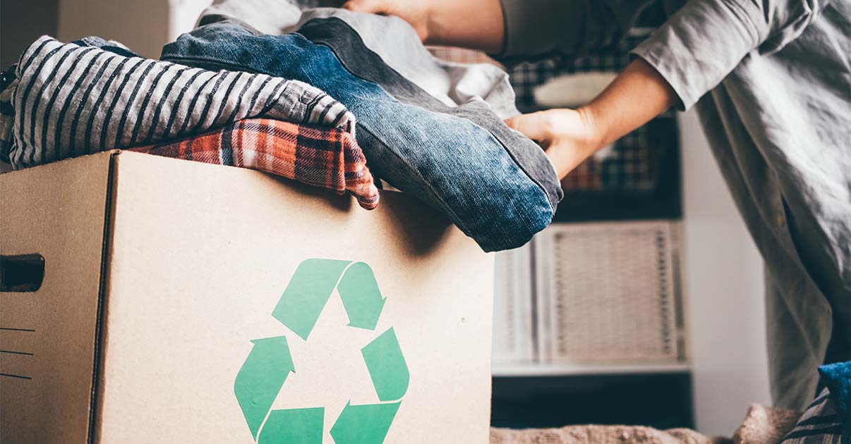 recycling box filled with clothes old clothes new lives