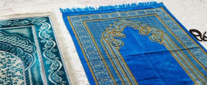 two blue and turquoise prayer mats