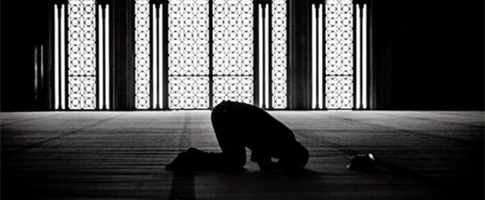 man in sujood position for prayer salah prayer timetables
