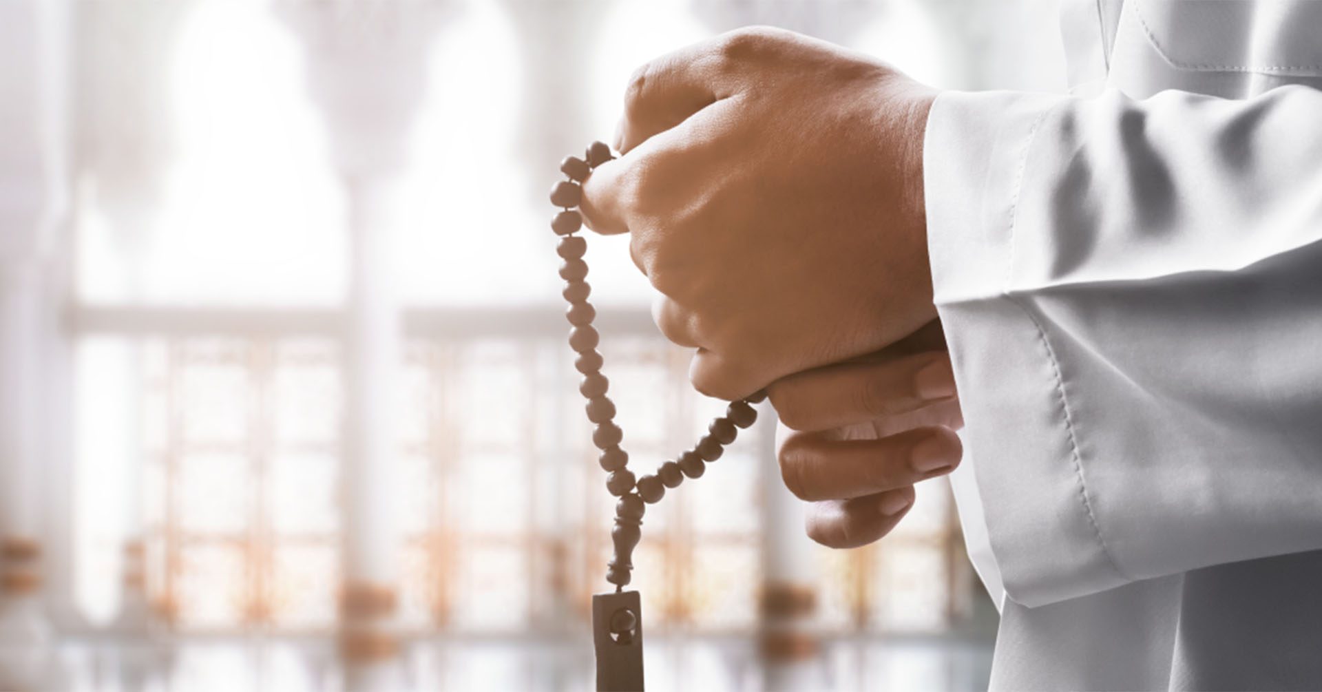 man doing dhikr using prayer beads (tasbih) prayer timetables glasgow