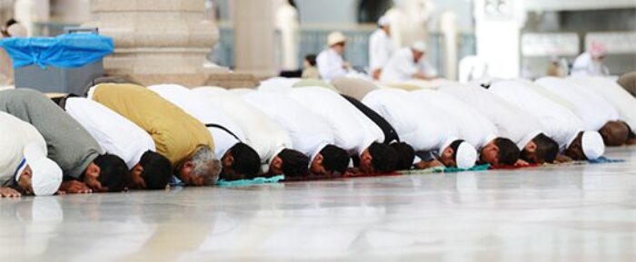 group of men during prayer salah in sujood prayer timetables
