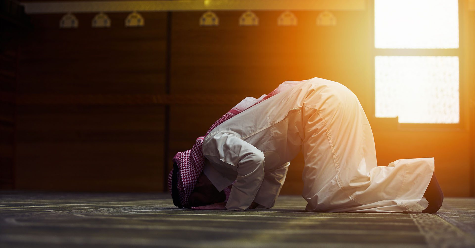 man in sujood for prayer (salah) prayer timetables rochdale