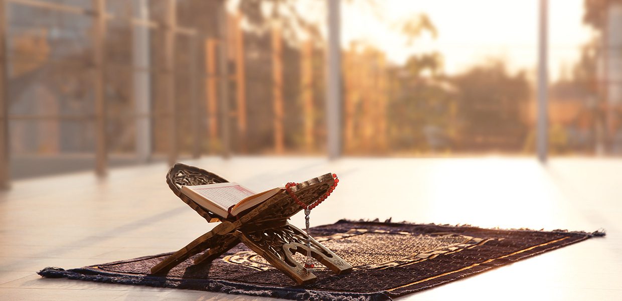 Qur'an, tasbeh and prayer mat in a mosque courtyard. tips for ramadan allah's love