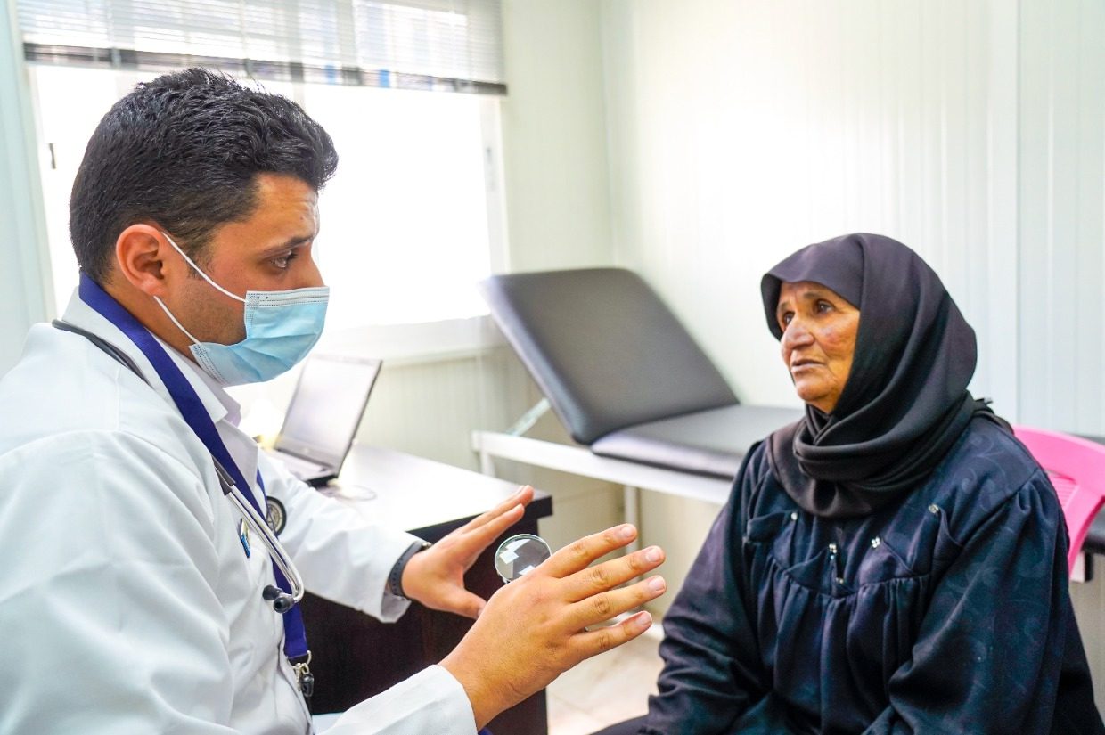 elderly women in jordan speaking to a doctor sadaqah for illness