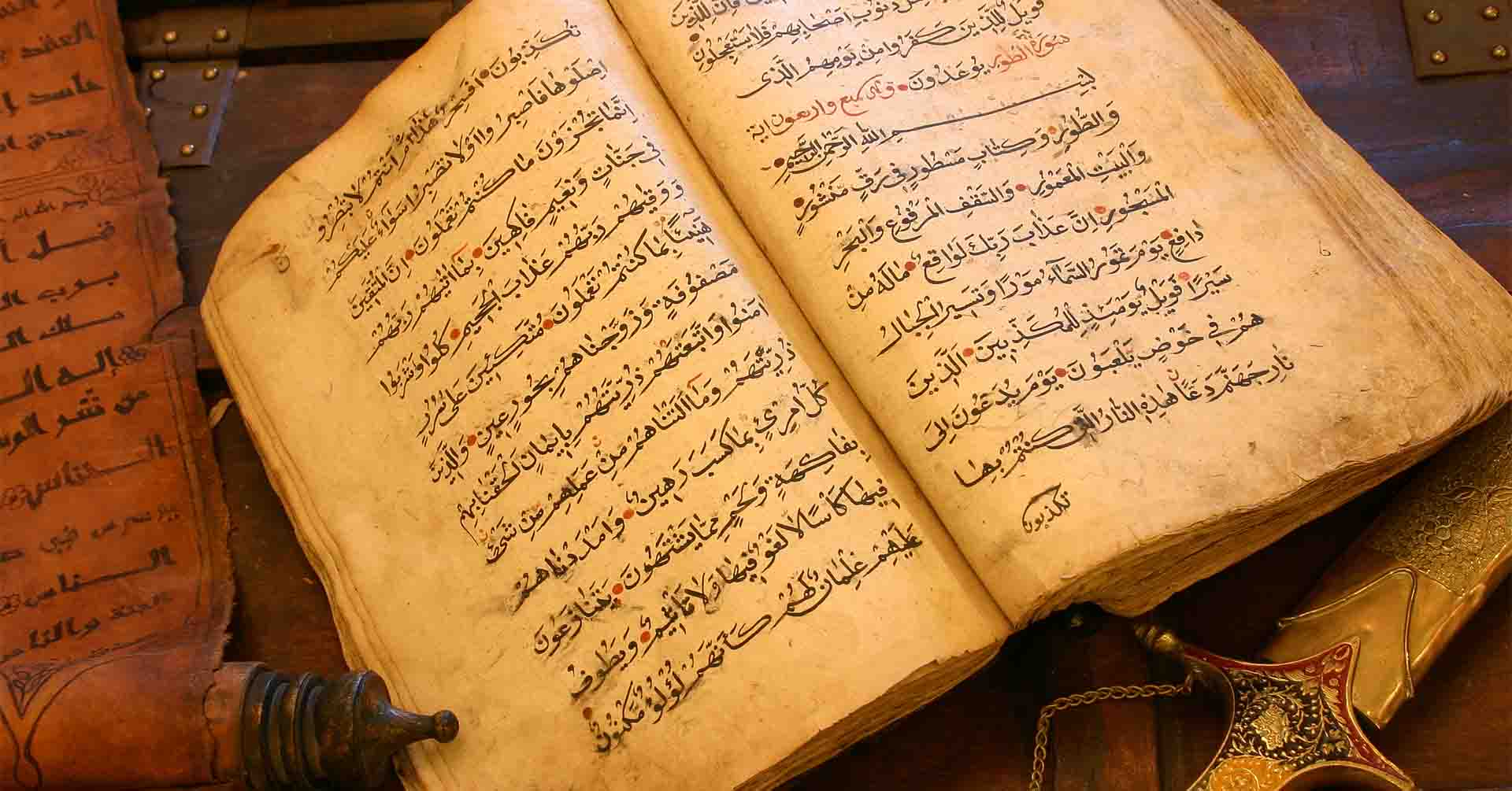 old antique handwritten quran, scroll and sword safar