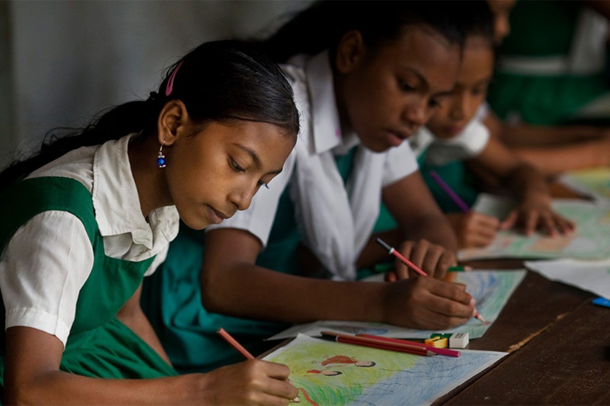 school girl writing in her book