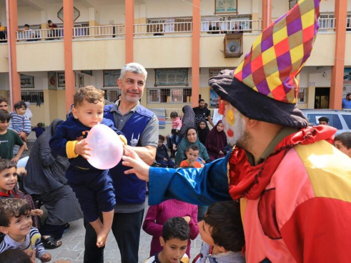 islamic relief staff in gaza playing with palestinian children to provide psychosocial support