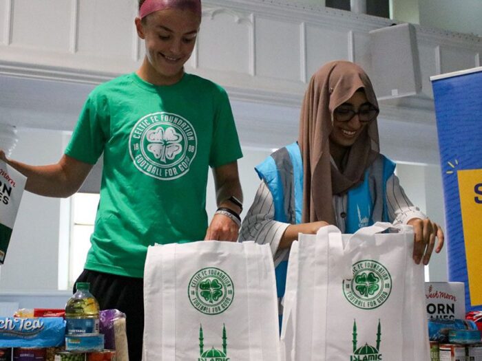 celtic fc and islamic relief packing food bags