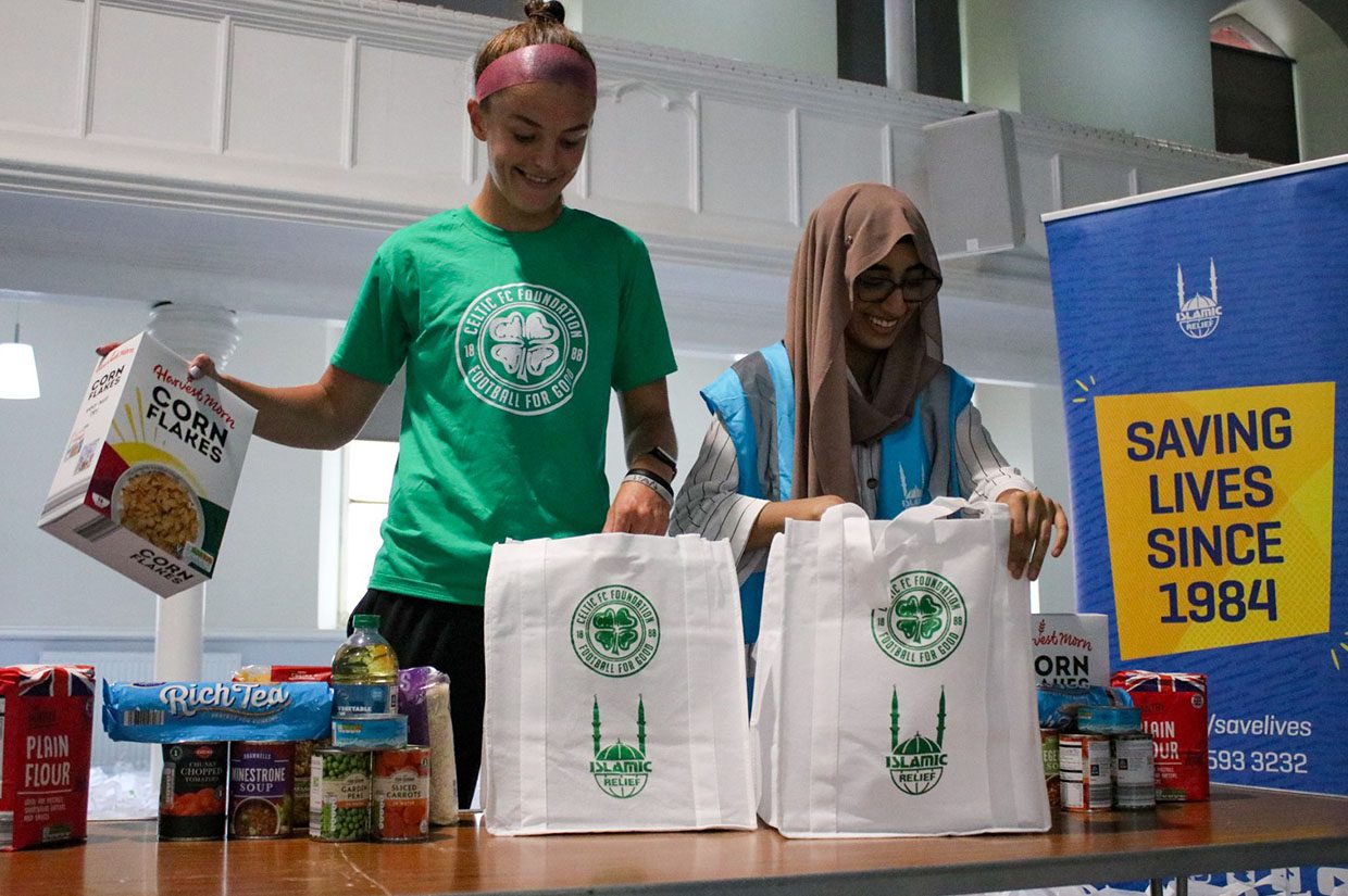 celtic fc and islamic relief packing food bags