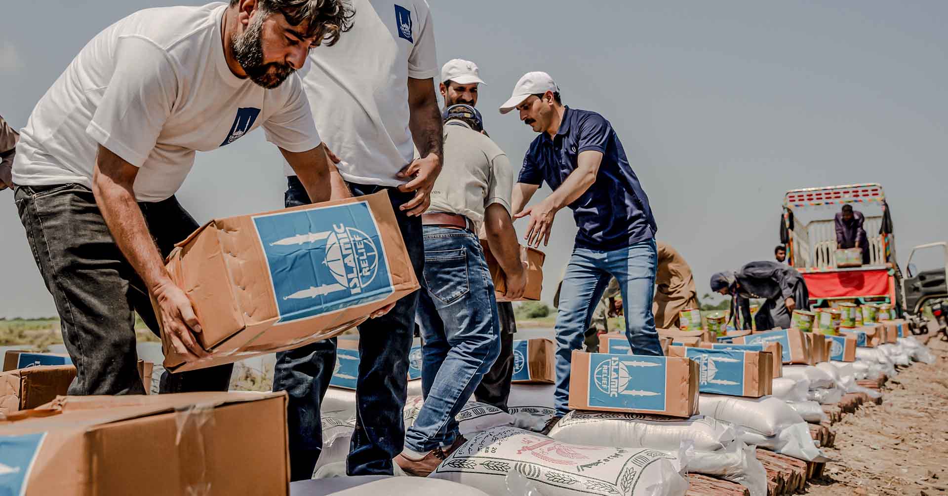 islamic relief representatives in pakistan arranging emergency aid to be distributed to victims of the pakistan floods where most needed