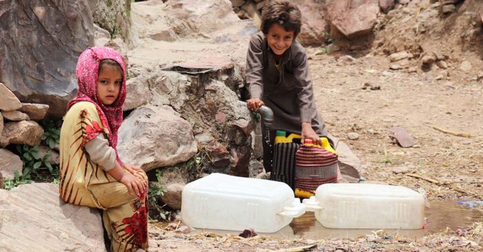 Children at water source created by Islamic Relief