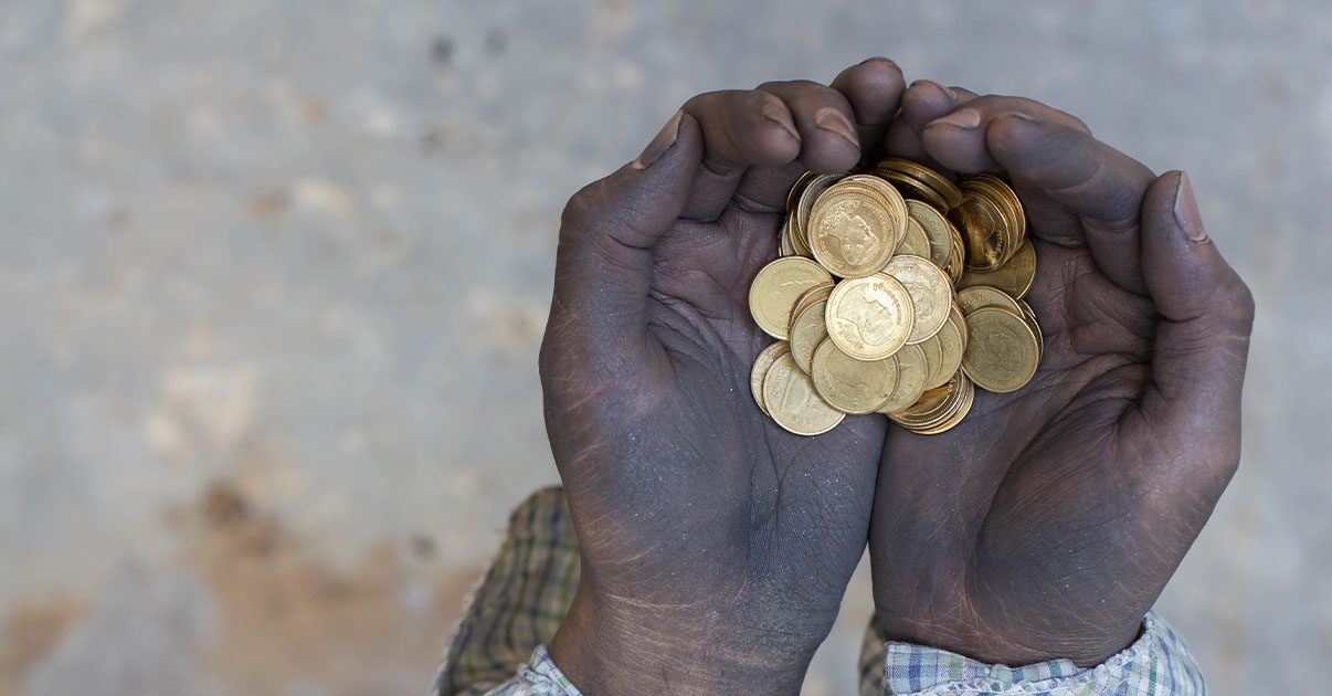 hands holding gold coins zakat on gold