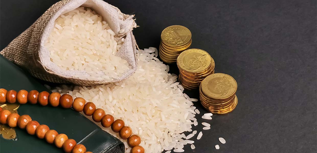 quran, prayer beads, bag of rice and gold coins zakat rules zakat calculator